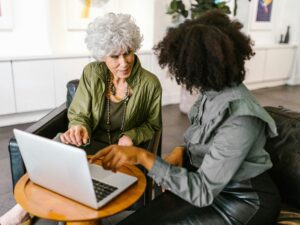 Colleagues Having a Discussion in front of a Laptop