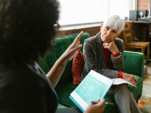 Elderly Woman Listening to the Person Talking