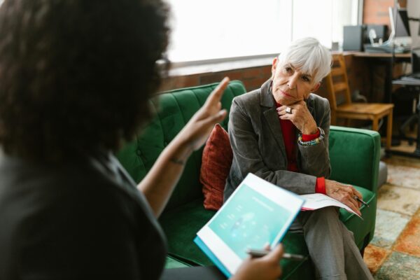 Elderly Woman Listening to the Person Talking